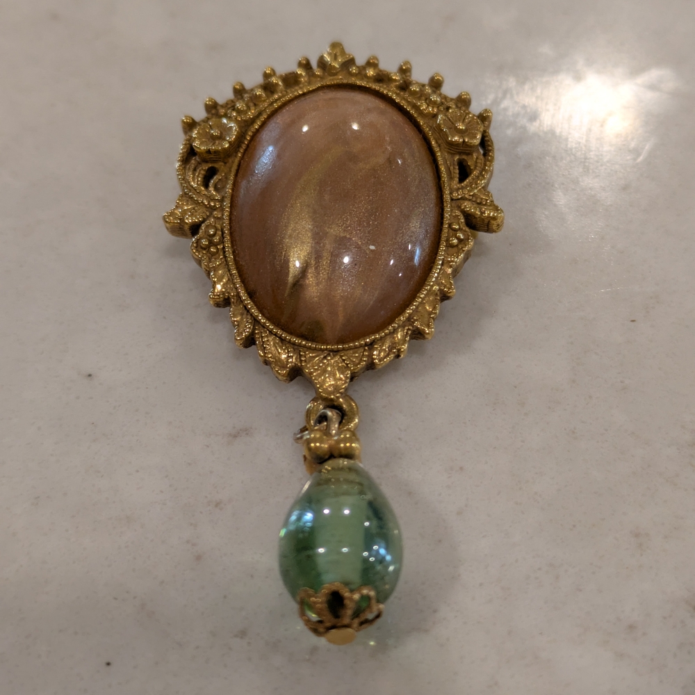 1928 Gold Tone Champagne, Peach Center Cab Green Glass Dangle Brooch